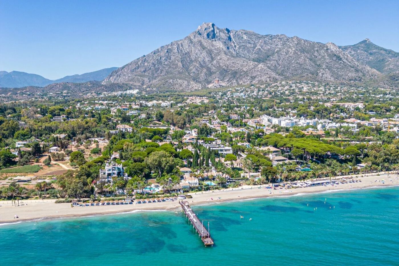 Marbella beachfront, its pier and La Concha mountain seen from the air